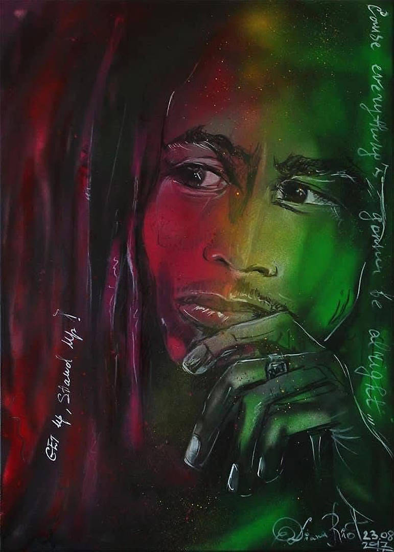 Spray paint and marker portrait of Bob Marley on canvas