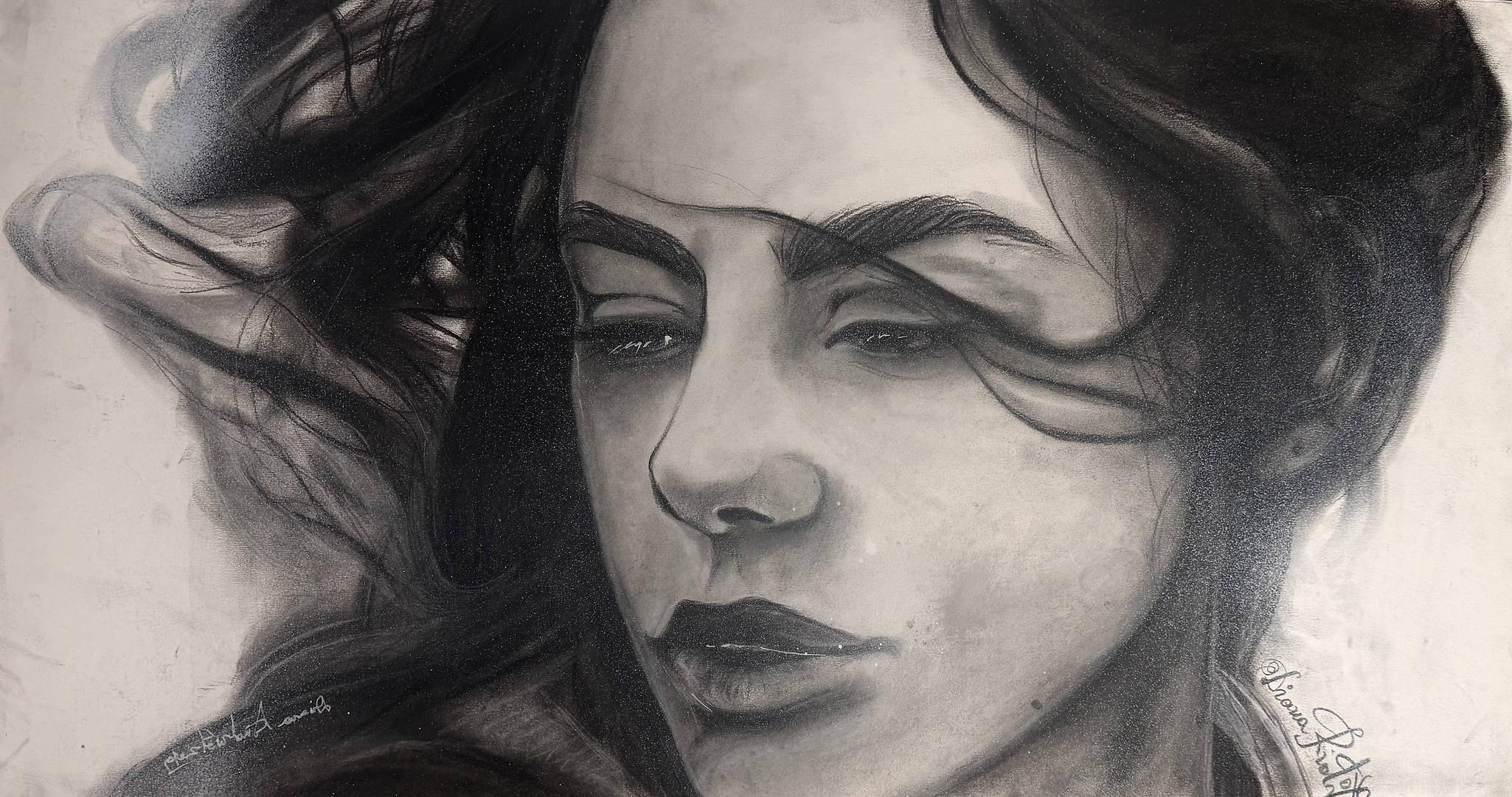 charcoal portrait of a woman with intense gaze and flowing hair