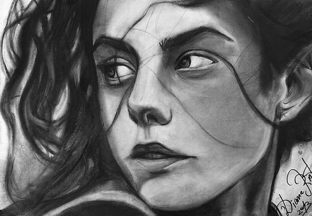 Charcoal portrait of Kaya Scodelario with detailed facial expression and emotional realism